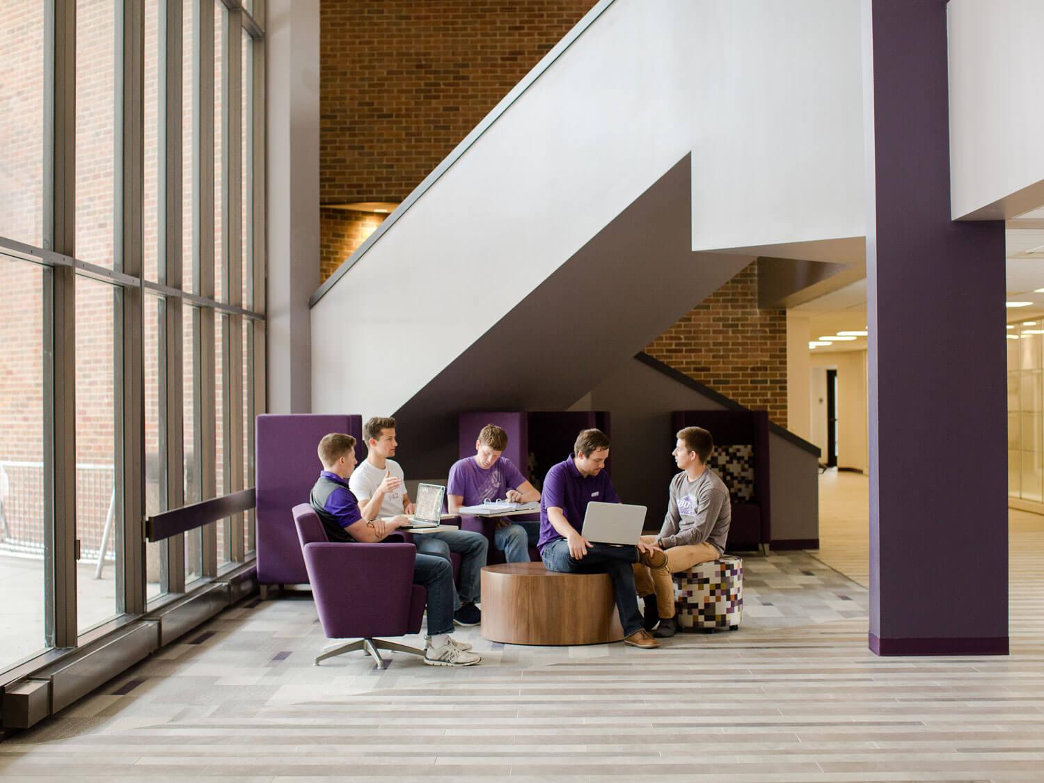 students studying in lobby of Taylor Center