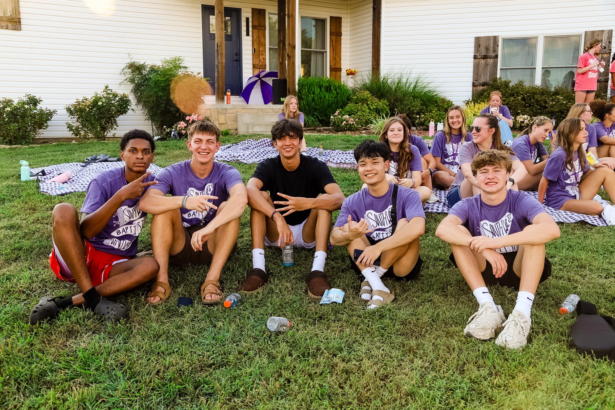 Students smiling during Welcome Week 2025 picnic. 