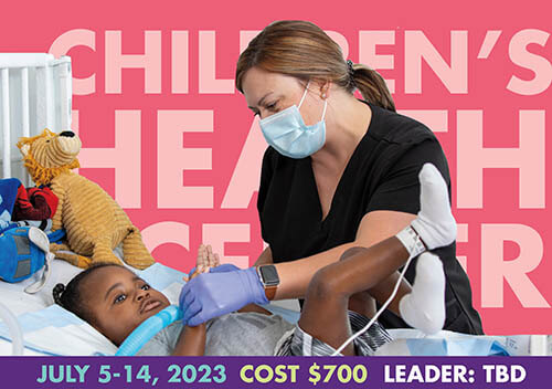 nurse assists young female patient laying in bed