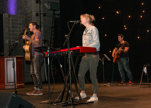 Jeremy and Kim Scowden lead praise and worship at Homecoming Chapel.