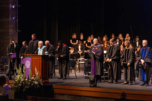 Dr. C. Pat Taylor prays at Inauguration ceremony