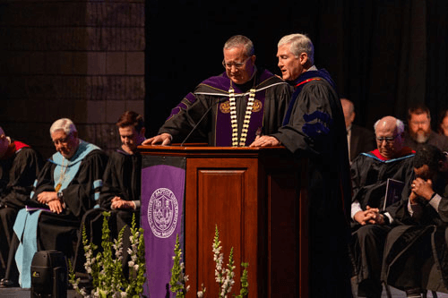 Dr. Douglas C. Walker, III prays over SBU President Dr. Rick Melson
