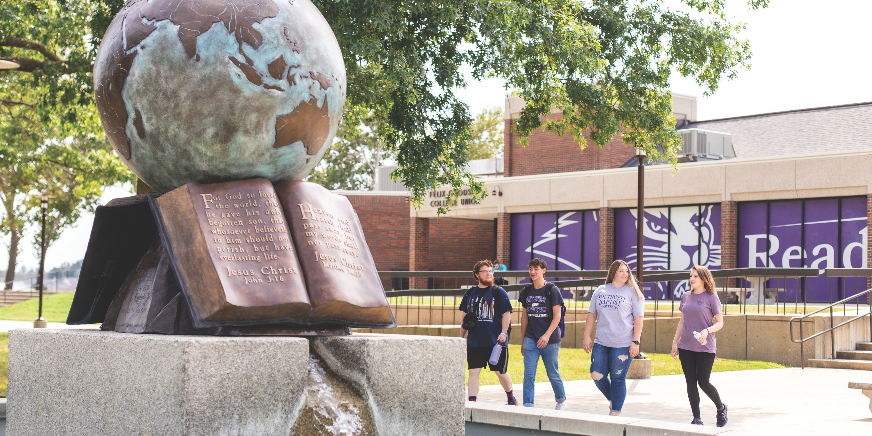 students by globe fountain