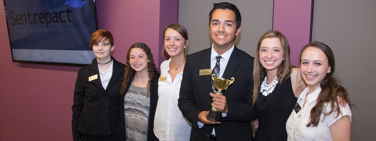 Sentrepact students holding trophy