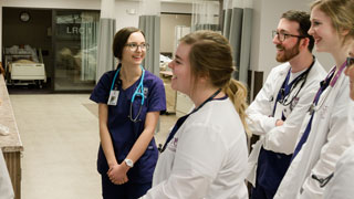 students talk and smile in nursing training center