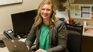 Female businessperson sitting at desk