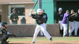 Baseball player getting ready to swing the bat at home plate