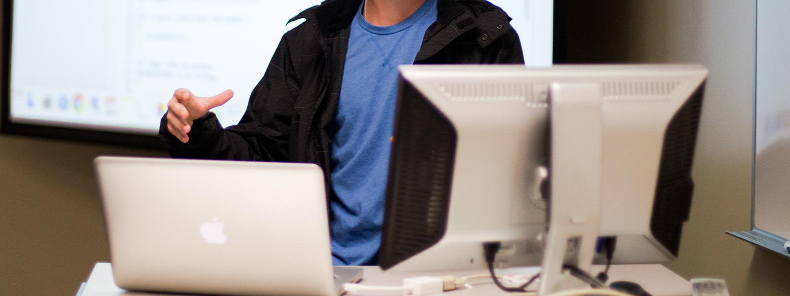 student working on laptop in classroom