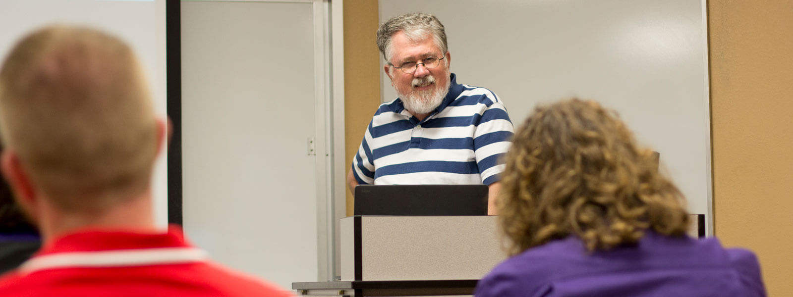 students listen to teacher lecture