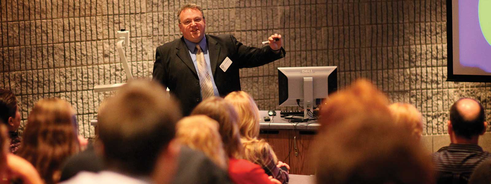 history professor giving lecture in auditorium