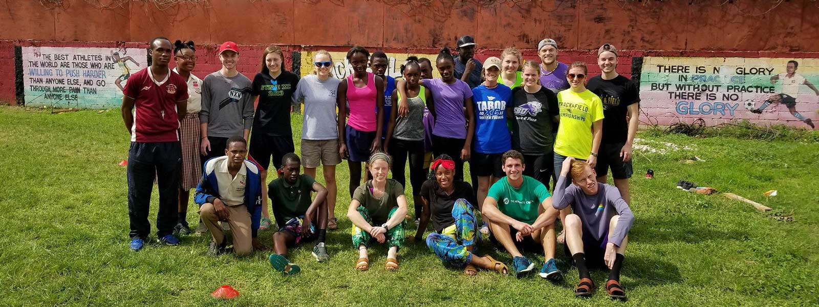 SBU students pose for photo with group of kids in Dominican Republic