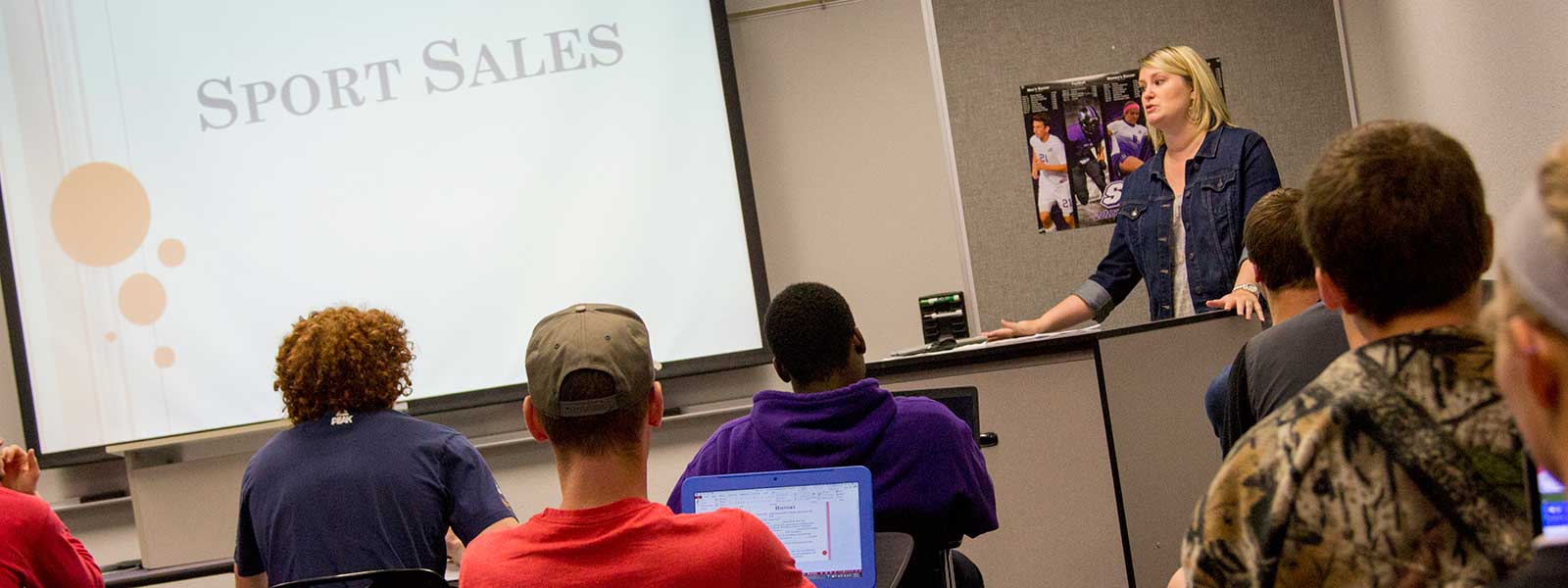 instructor giving presentation on sport sales