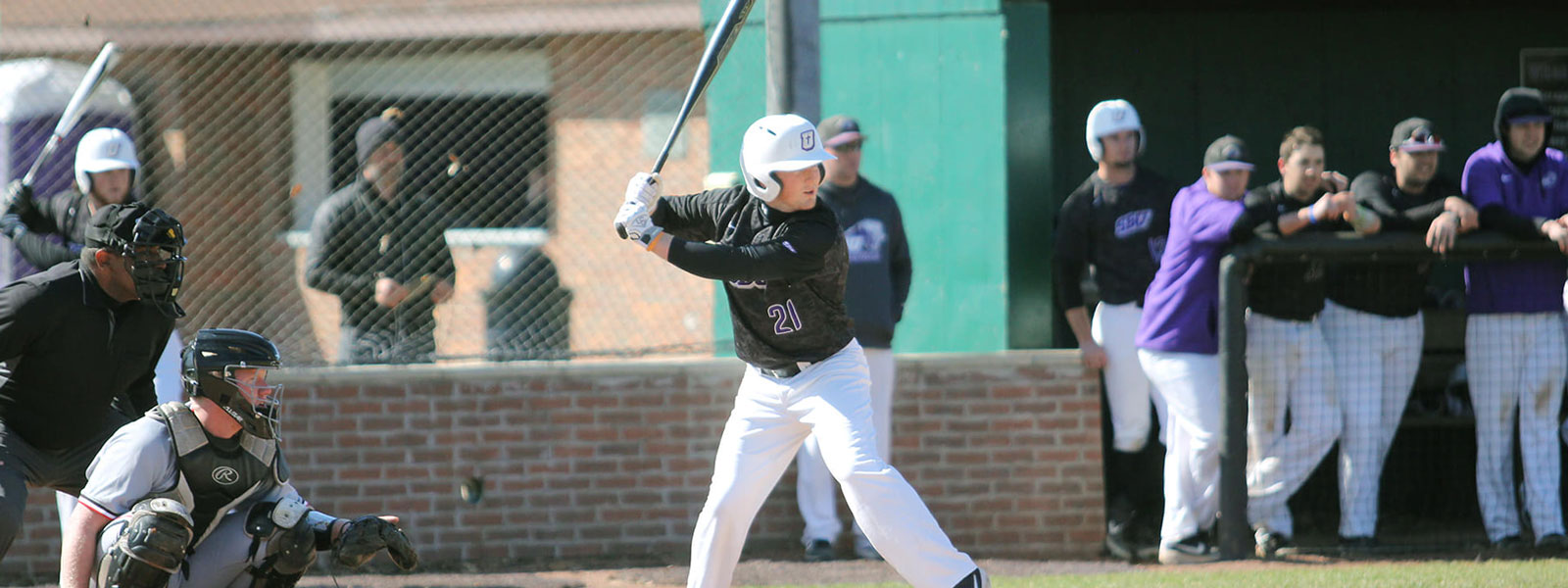 Baseball player getting ready to swing the bat at home plate