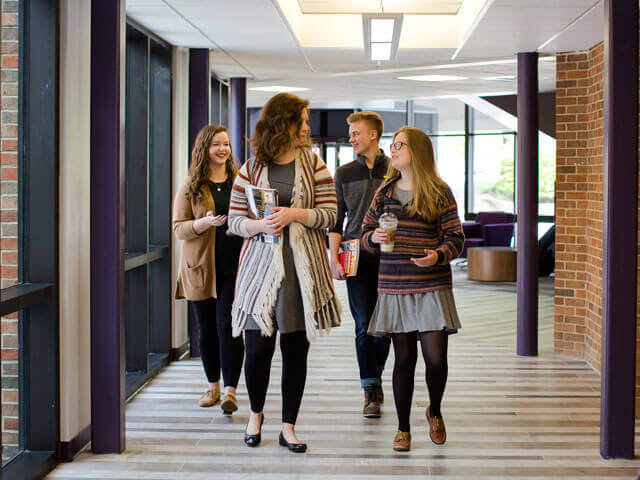 Professor and students walking to class