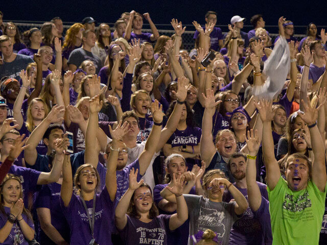SBU students cheering at football game