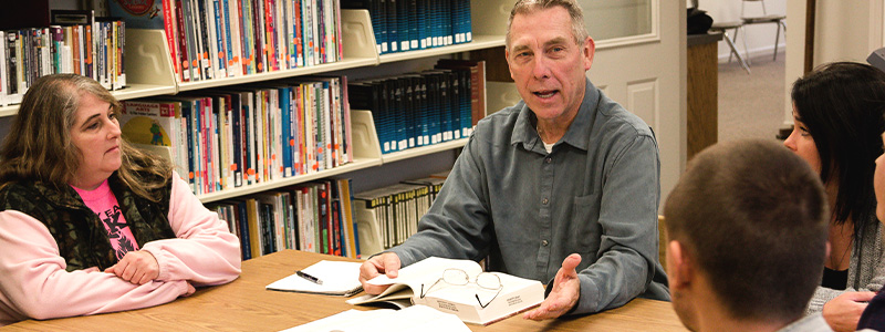 faculty member working with students